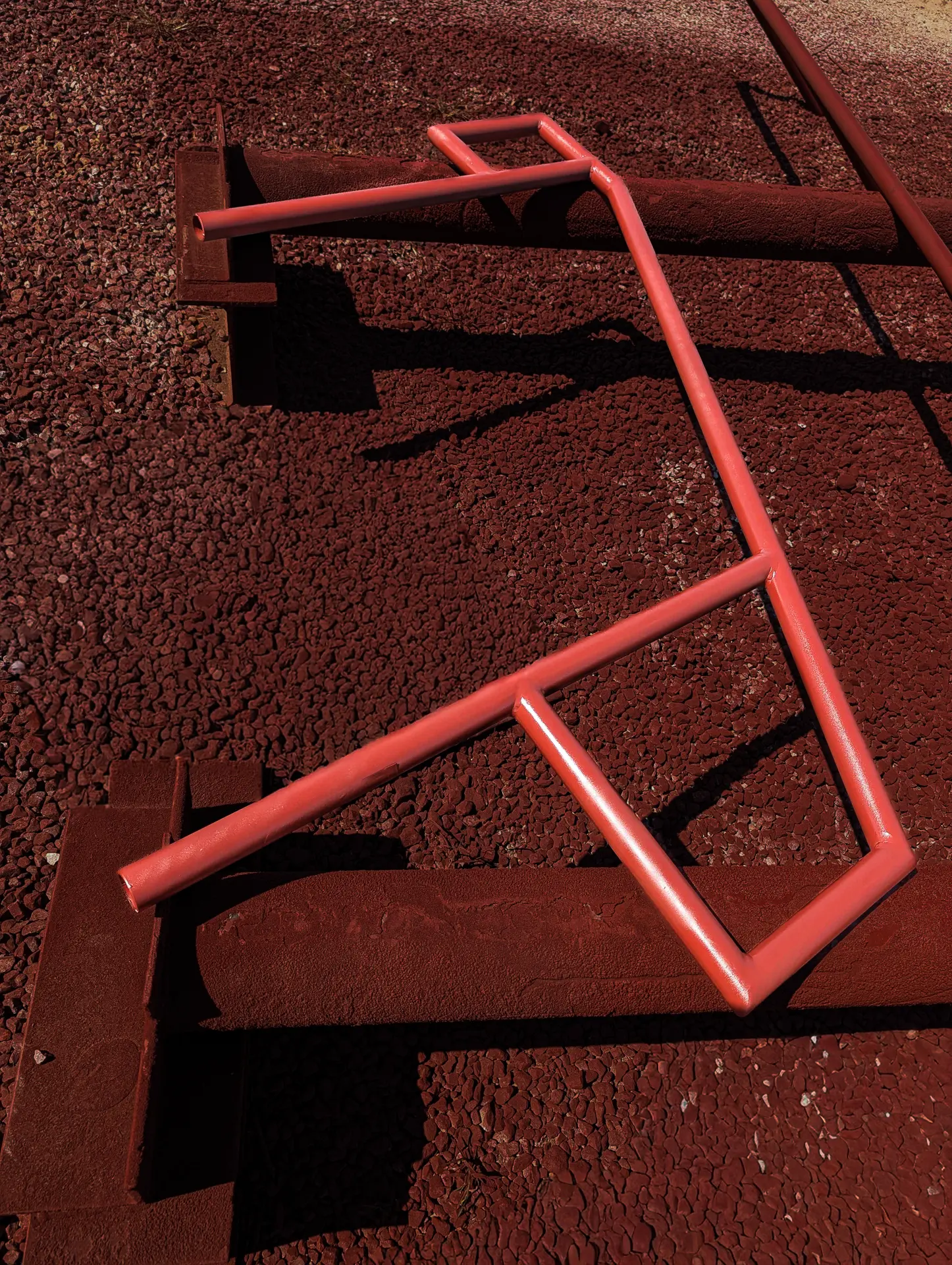 Finished steel handrail sections painted red in the DeVille Steel yard