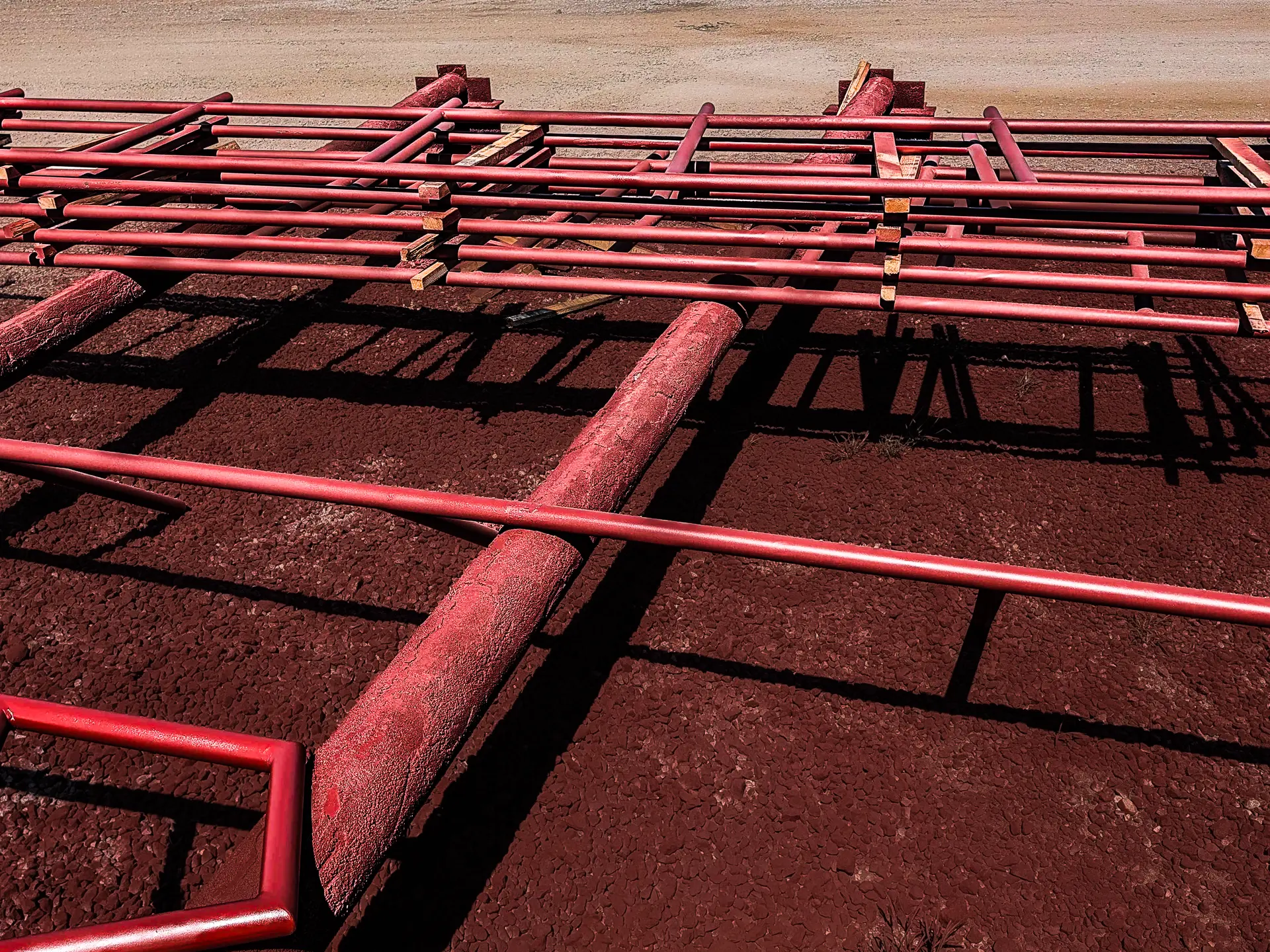 Painted handrail sections staged in the yard at DeVille Steel